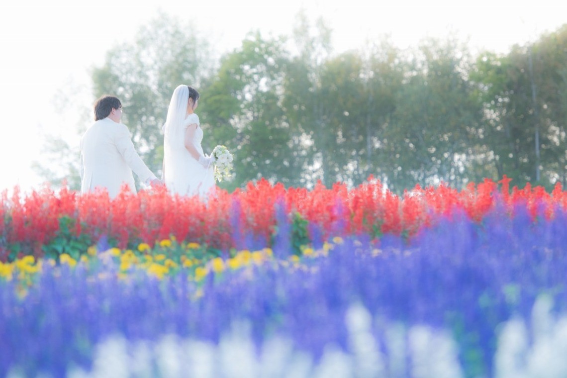 Wedding couple in the flower fields at Takino Suzuran Park